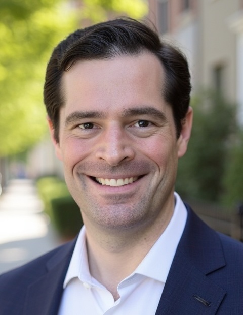 Yuri Broze wearing a blazer.